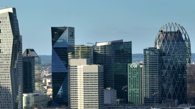 Aerial view skyscrapers modern business and financial district in Paris with high rise buildings and convention center. Blue cloudy sky in summer day. Reflections