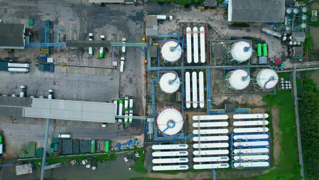 4K : Aerial view from drone flying over a storage tank industry (LNG or LPG), gas refinery, gas factory plant. fuel industry
