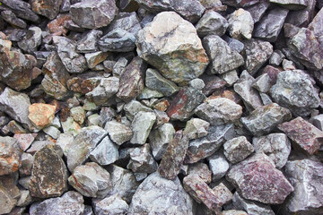Crushed granite texture close-up. Background made of a closeup of a pile of crushed stone.