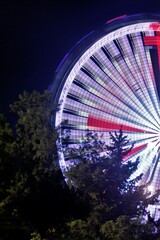 Ferris wheel in Antalya night with blurred lights lines