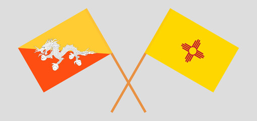 Crossed flags of Bhutan and the State of New Mexico. Official colors. Correct proportion