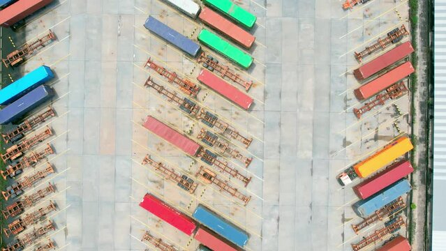 4K : Many of Semi-trailer trucks stand at the distribution center. cargo import export shipment. Industrial containers cargo shipment. aerial view footage. drone
