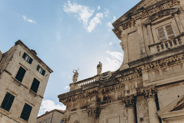 Fototapeta premium Dubrovnik, Croatia - September 21, 2021: rooftops in old town listed as UNESCO World Heritage Sites. Tourism and traveling. It was King's Landing, capital of Seven Kingdoms in show Game of Thrones.
