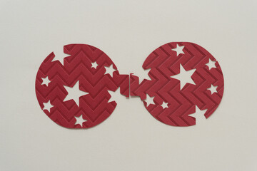 two round objects with stars on blank paper
