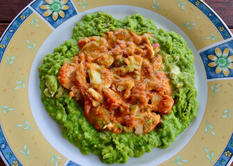 Lemon and pepper chicken with mashed peas
