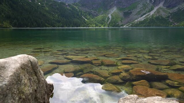 Morskie Oko (Sea Eye) is largest and fourth-deepest lake in Tatra Mountains. It is located deep within Tatra National Park, Poland, in Rybi Potok (Fish Brook) Valley, at base of Mieguszowiecki Summits