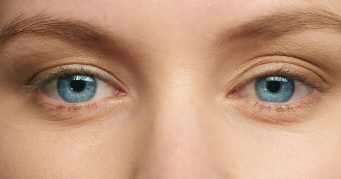 Beauty, vision and eye zoom of woman after ocular ophthalmology surgery focus dilated pupils to test for glaucoma or eyesight. Face of girl with closeup of beautiful, natural and healthy blue eye