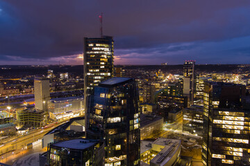 Obraz premium Beautiful aerial evening view of illuminated business district in Vilnius, Lithuania.