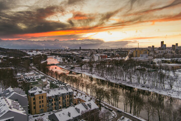 Scenic Vilnius city panorama in winter, Zirmunai district of a town. Aerial sunset view. Winter city scenery in Lithuania.