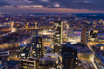 Beautiful aerial evening view of illuminated business district in Vilnius, Lithuania.