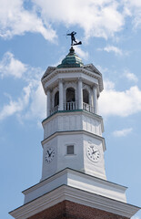 Fototapeta na wymiar A historic clock tower in Camden, South Carolina, USA, against a blue sky.