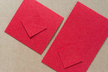 red felt shapes on corrugated paper