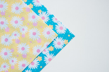 background with decorative floral felt prints and paper