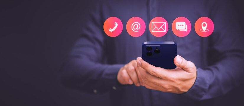 Businessman using mobile phone or smartphone with the call phone, email, address, chat message and map icons. Customer support hotline contact us people connection concept.