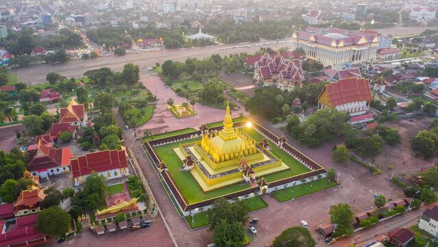 4k Hyper lapse shot aerial view by drone of Wat Phra That Luang , Vientiane, Laos PDR. sunset on Lao landmark temple.