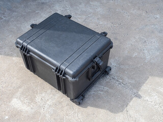 Black case on wheels. Shockproof case for expensive equipment. Concept case for multimedia or sound...