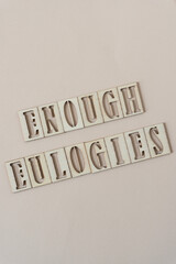 enough eulogies - sign with wood type