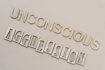 unconscious aggression - sign with wood type