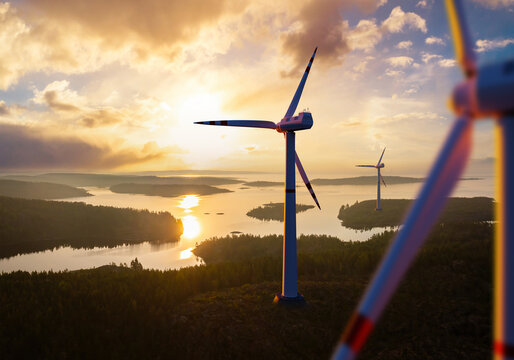 Wind farm wind turbines rise above river. Windmills before sunset. Black wind farm. Landscape sunset with windmills. Getting regenerative electricity. Taking care of power supply. 3d rendering