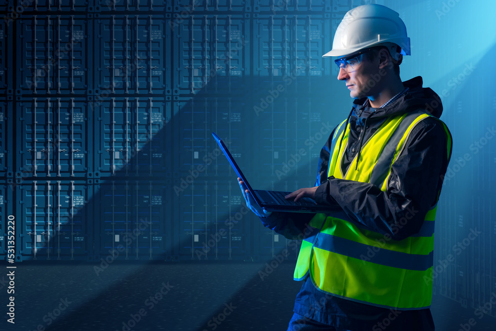 Poster logistic man. guy with laptop in front of shipping containers. container warehouse worker. warehouse