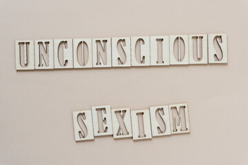 unconscious sexism - sign with wood type