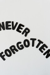 never forgotten (carefully arranged letters) - black chalk letters