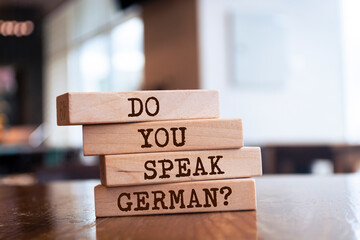 Wooden blocks with words 'Do you Speak German?'.