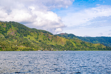 Scenic view of lake againts mountain and sky