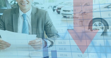 Red arrow going down and data with a salesman in a car dealerships