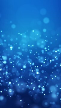 Video animation of blue light shine particles bokeh over blue background - abstract particles background - vertical video
