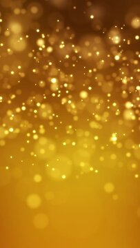 Video animation of golden light shine particles bokeh over golden background - abstract particles background - vertical video