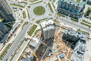 building site with high-rise building and cranes. construction site in newly developed...