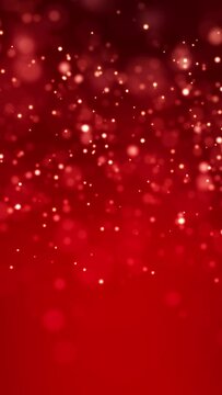 Video animation of golden light shine particles bokeh over red background - abstract particles background - vertical video