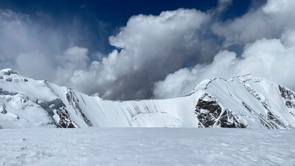 Fascinating mountain winter landscape. View of the snow-capped rocky mountains of the Pamirs.