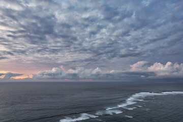 Beautiful red epic sunset sunrise and dramatic clouds over the dreamy sea - Bali