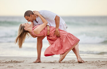 Love, dance and couple dancing at the beach in summer celebrate their marriage, happiness and...