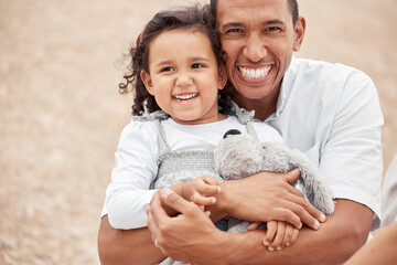 Happy family at beach, father gives kid a hug with smile on her face and laughing with dad. A summer getaway, traveling the world on vacation with family and holidays with friends is a great a break