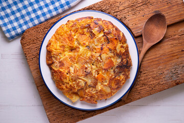 Potato and sweet potato omelette. Modern Spanish recipe of the traditional tortilla tapa.