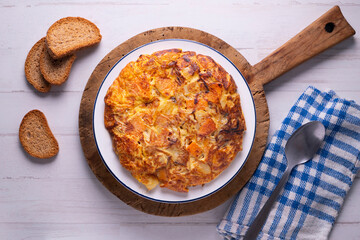 Potato and sweet potato omelette. Modern Spanish recipe of the traditional tortilla tapa.