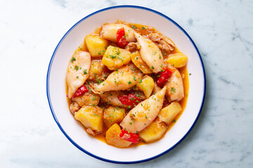 Squid stew with red peppers. Typical Spanish tapa recipe.
