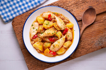 Squid stew with red peppers. Typical Spanish tapa recipe.