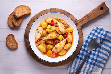 Squid stew with red peppers. Typical Spanish tapa recipe.