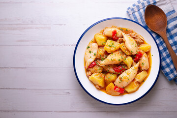 Squid stew with red peppers. Typical Spanish tapa recipe.