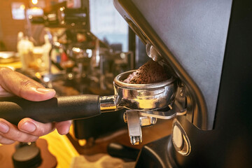 Close-up of espresso pouring from coffee machine.