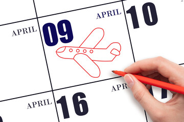 A hand drawing outline of airplane on calendar date 9 April. The date of flight on plane.