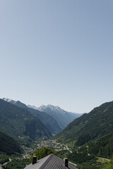 Naklejka premium Country house cottage roof, mountains, valley, forest, sky with clouds. Landscape