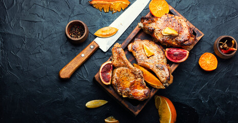 Steak on the bone grilled with citrus fruits.