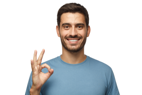 Young smiling man having happy look, gesturing, showing OK sign or showing okay gesture with his fingers