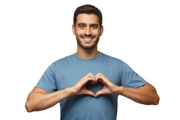 Young smiling handsome smiling male in blue t-shirt showing heart sign - obrazy, fototapety, plakaty
