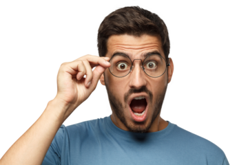 Angry young teacher in blue t-shirt shouting, displeased with bad behaviour, holding round eyeglasses with one hand